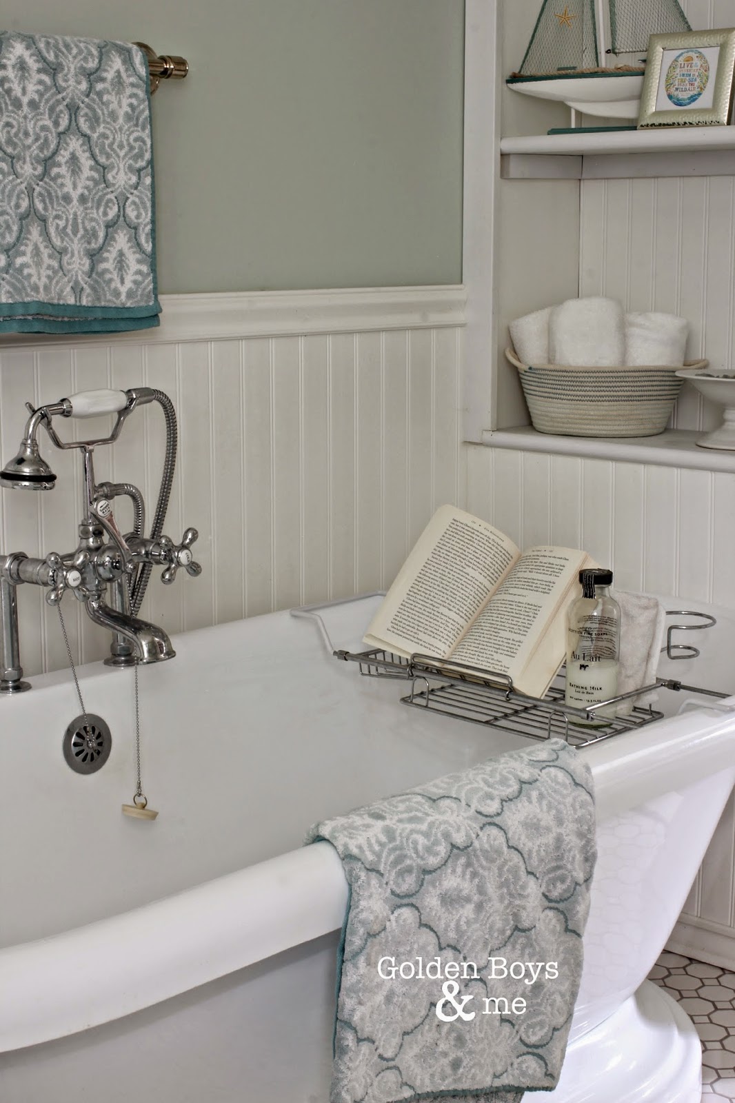 Pedestal tub with vintage style faucet and over the tub rack