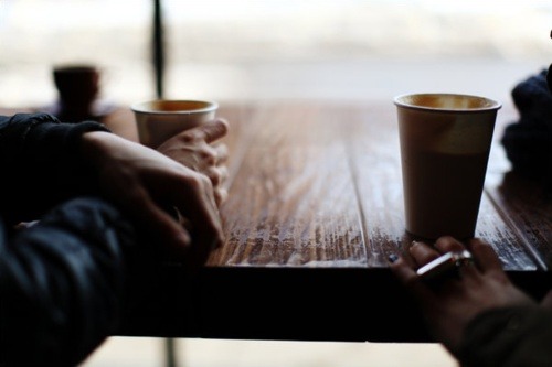 couple in a cafe having a conversation