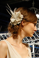 Intricate Chignon Hairstyle with a Fabric Flower