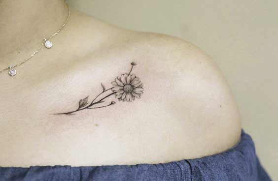 flower tattoo under collarbone