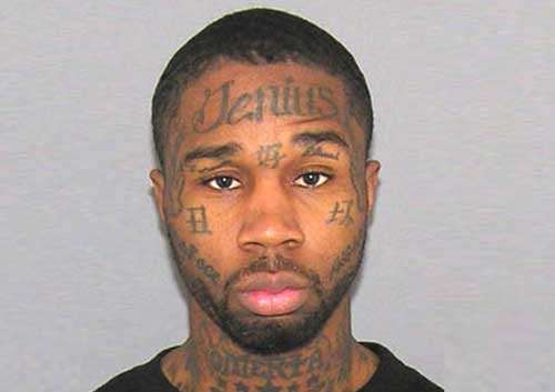 But his tattooed face has the misspelled word'Jenius' on his forehead
