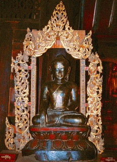 sitting wooden Buddha statue