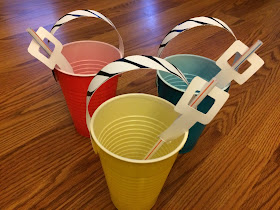 Easily and quickly make cute sand pail bucket cups for your beach party.  Using these free printables and DIY directions, you and your beach party guests will be on the beach sipping your favorite drink in no time at all.