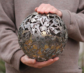 Recycled art made from old key and coin