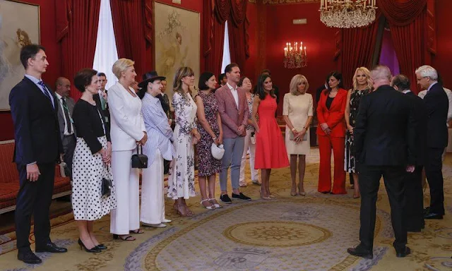 Queen Letizia wore a fuchsia fit and flare sleeveless bespoke dress by Carolina Herrera. Brigitte Macron, Begoña Gomez