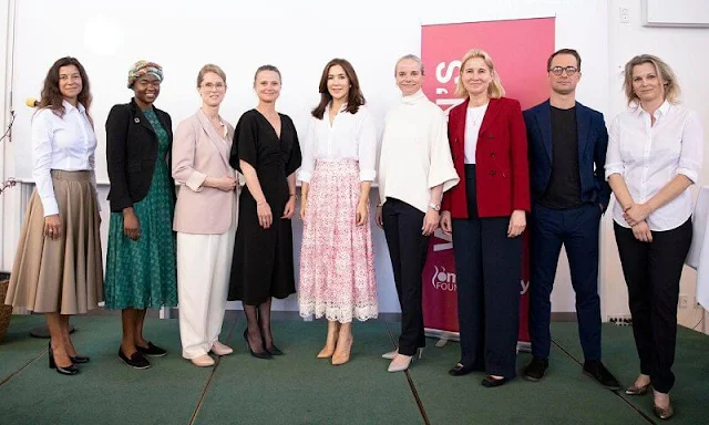 Crown Princess Mary wore a pink floral textured lace detail midi skirt and a white shirt. Gianvito Rossi python pointed toe pumps