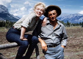 Marilyn Monroe and Robert Mitchum on the set of River of No Return (1954)