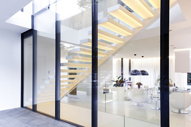 White modern staircase by the glass wall