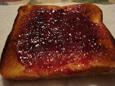 toast with red raspberry jam