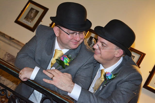 Richard and I at Stockport Town Hall, in our wedding bowlers and rainbow buttonholes at our wedding