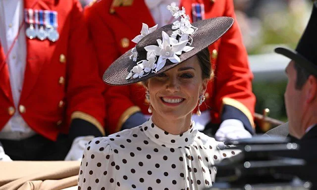 Kate Middleton wore a new asymmetric polka-dot silk crepe dress by Alessandra Rich. Pearls diamond earrings