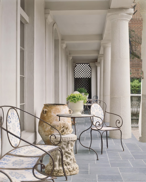 Beautiful stone patio at French inspired home in Houston Murphy Mears