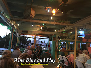 The patio facing Matlacha Pass and the Gulf of Mexico at the Old Fish House Marina in Matlacha, Florida