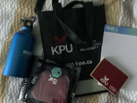 Photo by Sheila Webber: the WILU conference freebies including a water bottle and a sticky notes pad