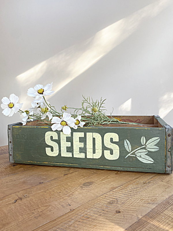 seed crate with flowers