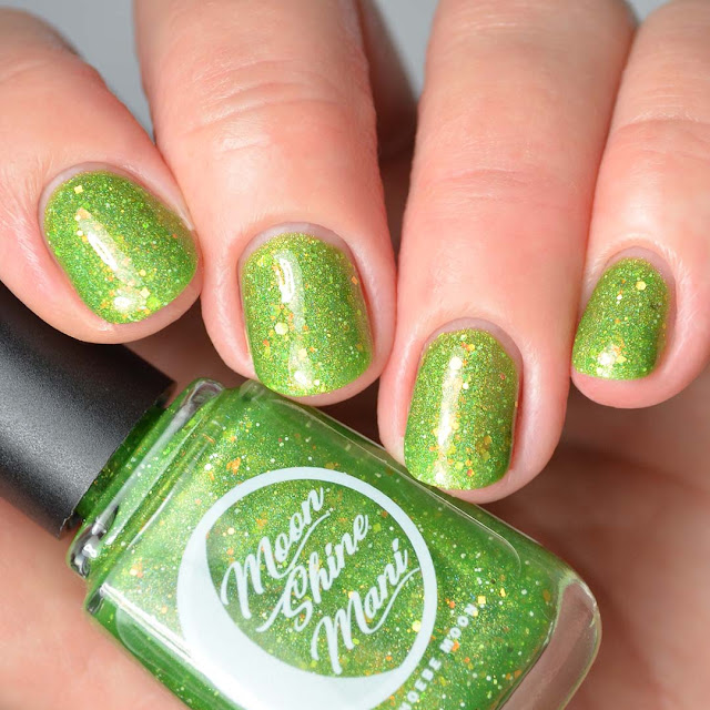 green nail polish with iridescent glitter swatch