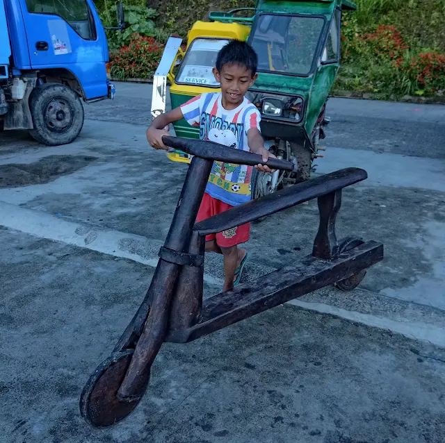 Young Kid  Wooden Bike Riders of Banaue Ifugao Cordillera Administrative Region Philippines