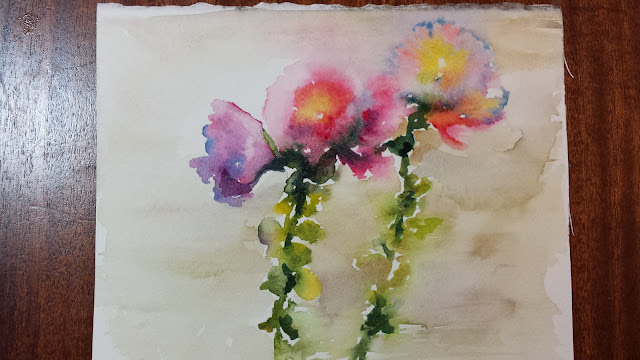 Hollyhocks in watercolor on watercolor paper.  