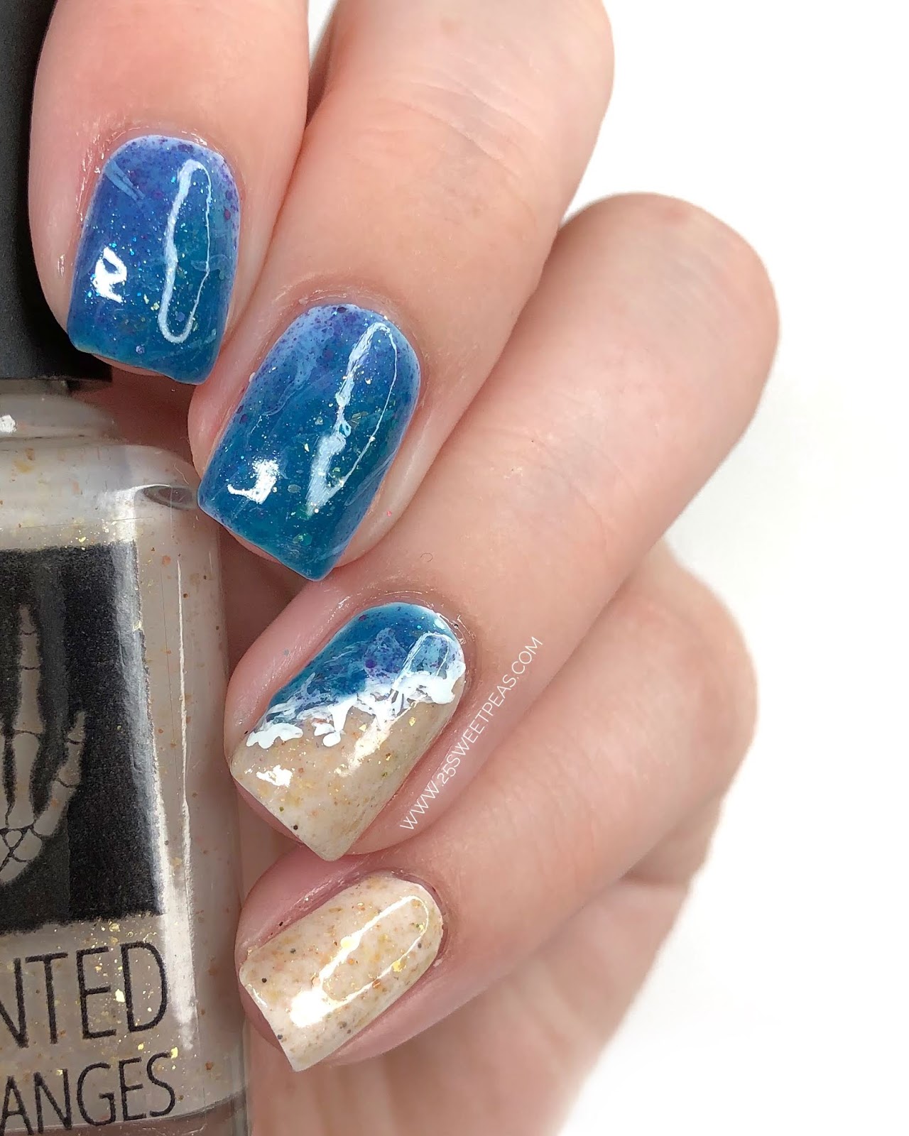 Under the Sea 30+ Seashell Nail Art Ideas : Chrome Blue Nails with Pearl