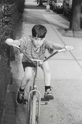 dorky dangerous bicycle kid dork idiot riding on sidewalk