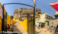 Upon reaching the end of the ramp, we came across a Balaji (Hanuman) temple on the right and a big board that stated that the entry to the temple is permitted, but the fort is a private property and the standard "trespassers will be prosecuted" notice. We noticed that all the gates to the fort, except the one leading to the temple, were locked.