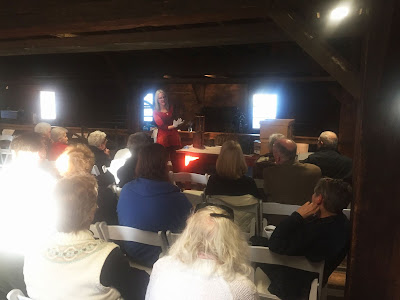 Curator Sarah Buffington shows artifacts to members-only audience