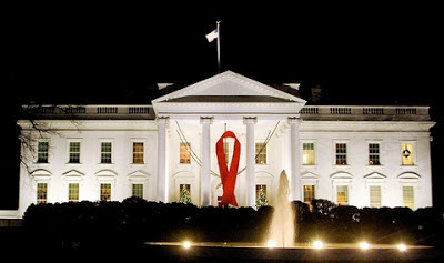 White House at nighttime with the Red AIDS Ribbon