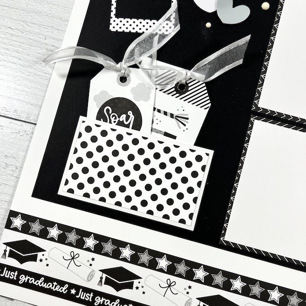 12x12 Graduation scrapbook page with hats, diplomas, stars, & a pocket with tags