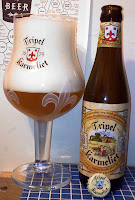 Tripel Karmeliet beer glass and bottle with huge head