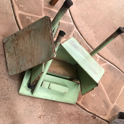 A garden tool box that has fallen apart.
