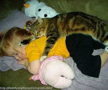 Baby and cat sleeping.