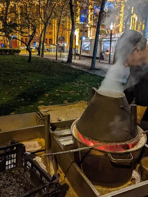Smoking roaster of a chestnut vendor in Lisbon at Christmas