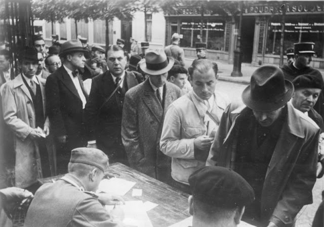 Jews who have been arrested in Paris being processed by the police, 21 August 1941 worldwartwo.filminspector.com