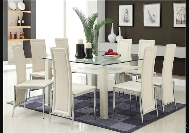 Elegant Glass Dining Table with glass top and six white leather chairs plus awesome beige carpet