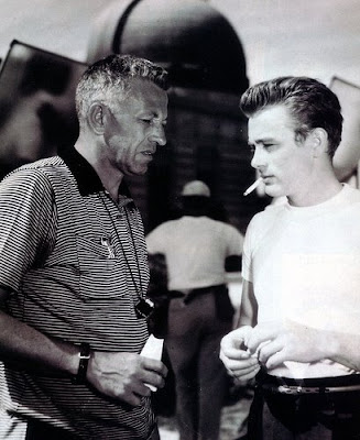 Director Nicholas Ray confers with James Dean on the set of Rebel Without a