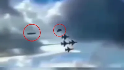 A double UFO sighting over the USA at an air display show.