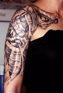 biomechanic tattoo: strange eyes hidden behind some alien-like tissues and bones