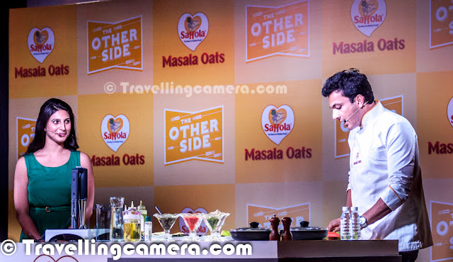  Yesterday we had an invite to participate in a Blogger Meet organized by Saffola Masala Oats and Vikas Khanna was main guest there. He flew from US to India for this event and it was really an exciting opportunity for us to interact with one of the best Chefs in the world. After meeting I found him a great person as well.Let's check out this Photo Journey and know more about my personal experiences of this sepcial day with Bindas Punjabi who is based in US now.   Usually such blogger meets are great ways to interact with other bloggers from North India, but this time most of the bloggers were excited to meet Vikas Khanna in Person. Almost every blogger was on time and as expected Chef Vikas Khanna made us wait for some time but it was worth. As he joined us at Blue Frog with his amazing smile, the whole environment changed immediately. Probably I was least aware of him. I knew very basic stuff about him and everyone else had probably all details about his past life and his lifestyle. Girl Bloggers were really mad about the event and we could literally see lot of unusual stuff that doesn't happen during other meets. Anyways, it was great to meet him in person and understand the great Chef.   I loved when we started talking in Punjabi & Hindi, although he couldn't control to talk in English in between. His style was awesome and he was continuously cracking some subtle Punjabi jokes in between. Of course, he shared some great tips about food and how different ingredients can be used in innovative way.   Born in Amritsar, Vikas Khanna began his culinary experience as a helper in his grandmother's kitchen and learned the art of cooking & the use of spices from her. He talked about his mom many times and related food with love. And had some great views about food and mothers who feed the whole family with love. He began developing recipes at a very young age. He graduated from the Welcomgroup Graduate School of Hotel Administration and established SAANCH, a cultural festival gala, to bring together various foods and traditions from different parts of India. This festival has been an important event in the college's calendar. He has worked for the Taj, Oberoi, Welcomgroup and Leela Group of Hotels and with some of the most influential chefs of the world including Gordon Ramsay, Bobby Flay, Jean-Georges Vongerichten.  Above photograph shows Vikas interacting with bloggers who participated in cooking contests. And there were two contestants out of 12. He really impressed everyone out there. Chef Vikas Khanna completed his graduation from Welcomgroup Graduate School of Hotel Administration also known as WGSHA, Manipal.He has also studied at Cornell University, Culinary Institute of America, and New York University. Vikas also appears in Marquis Who's Who in America 2012 edition.    He himself made two dishes and talked a lot of Tindas :). And I can't believe the depth he reached while talking about tindas and various ways to cook it. btw, Saffola Masala Oats were the highlight of the event. Second round of cooking involved dishes created with Oats. Vikas met all contestants, talked about their ideas and tasted their dishes. Oat Pizza was one of his favorites which also won the contest. Check out more about Vikas Khanna @ http://en.wikipedia.org/wiki/Vikas_Khanna