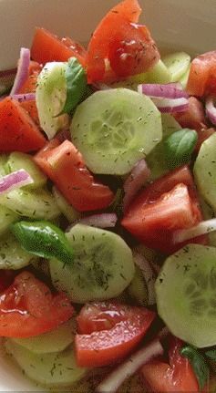 A simple, healthy recipe for cucumber tomato salad with red onions, basil & a homemade vinaigrette dressing.