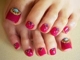 Hot candy pink; turqouise (real); i surrounded the turquoise with micro beads then teardrop citrine crystals for big toe feats; dark amethyst crystals and micro beads on other toes - acrylic nail art design