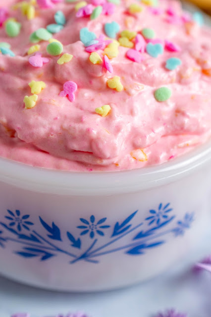 close up of pink dip in a white bowl.