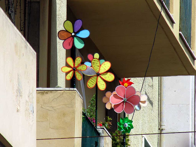 Balcony with wind wheels and spinners, via Cambini, Livorno” is all for 