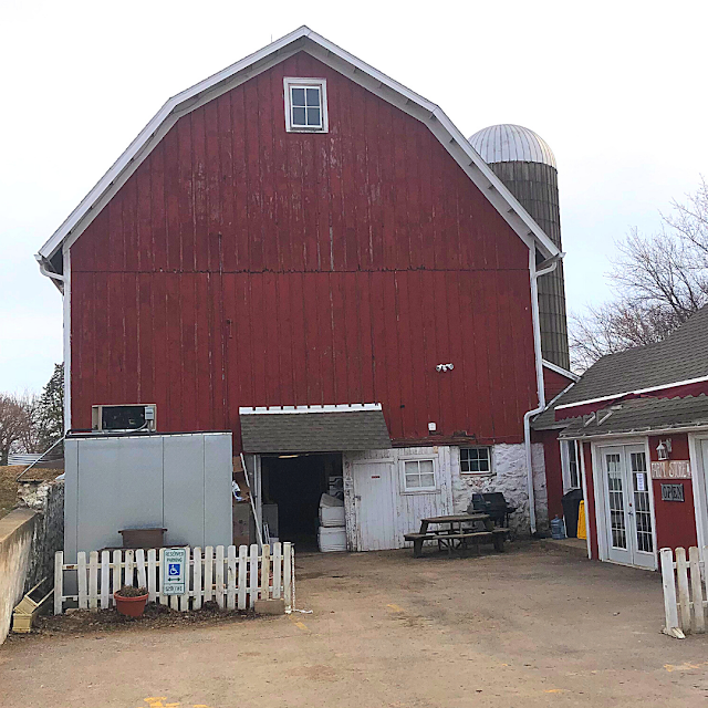 The barn at All Grass Farms invites you forward to an afternoon on the farm!