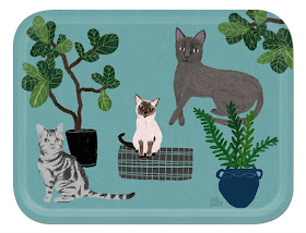 tray with sky blue background and pictures of three cats, plus some plants