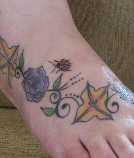 Flowers Leaves and Ladybug tattoos