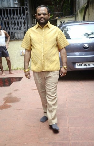 Indian business man wears 4kg gold shirt