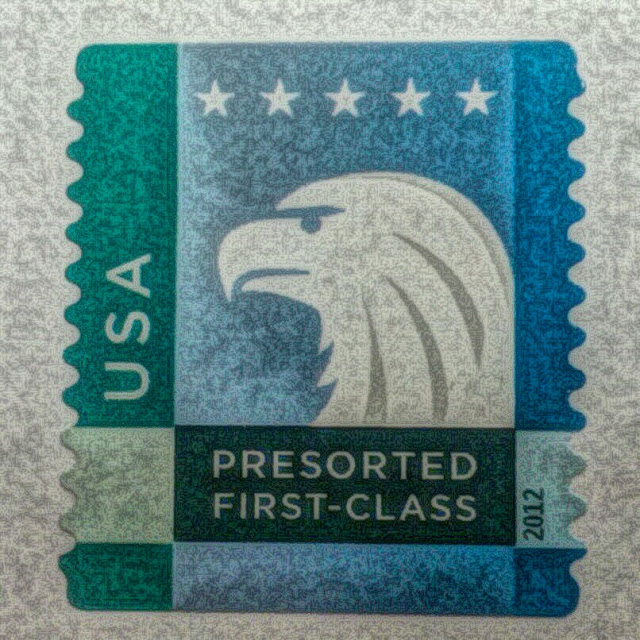 Public domain picture of a post stamp with an eagle head.