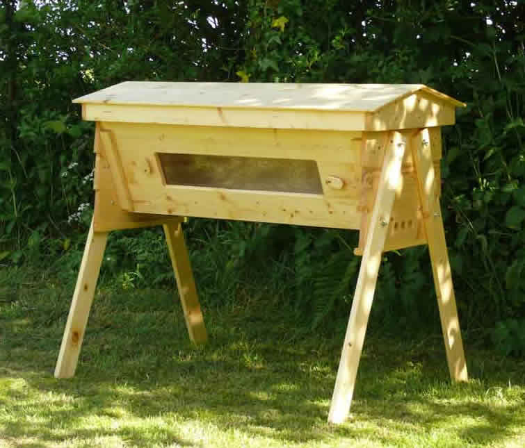 Top bar bee hive with viewing window so bees can be observed without 