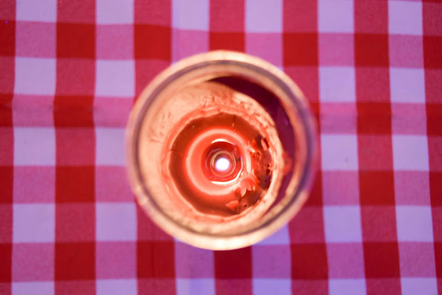 Joanna Joy A Stylish Love Story Lifestyle Blog California Fashion Blogger Candle White and Red Checker Table Cloth Lit Candle Candlelight