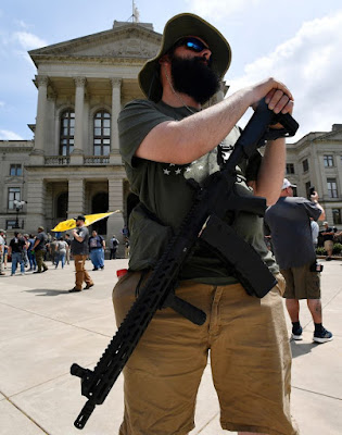 Gun rights activists rallied at state capitols across the United States carrying various firearms- rifles, handguns, placards, banners... protesting the demands for tougher gun laws following the February school shooting in Parkland, Florida, that killed 17.  One group, National Constitutional Coalition of Patriotic Americans, says organizers have permits to rally in 45 states and encouraged supporters to bring unloaded rifles in states where it’s legal.